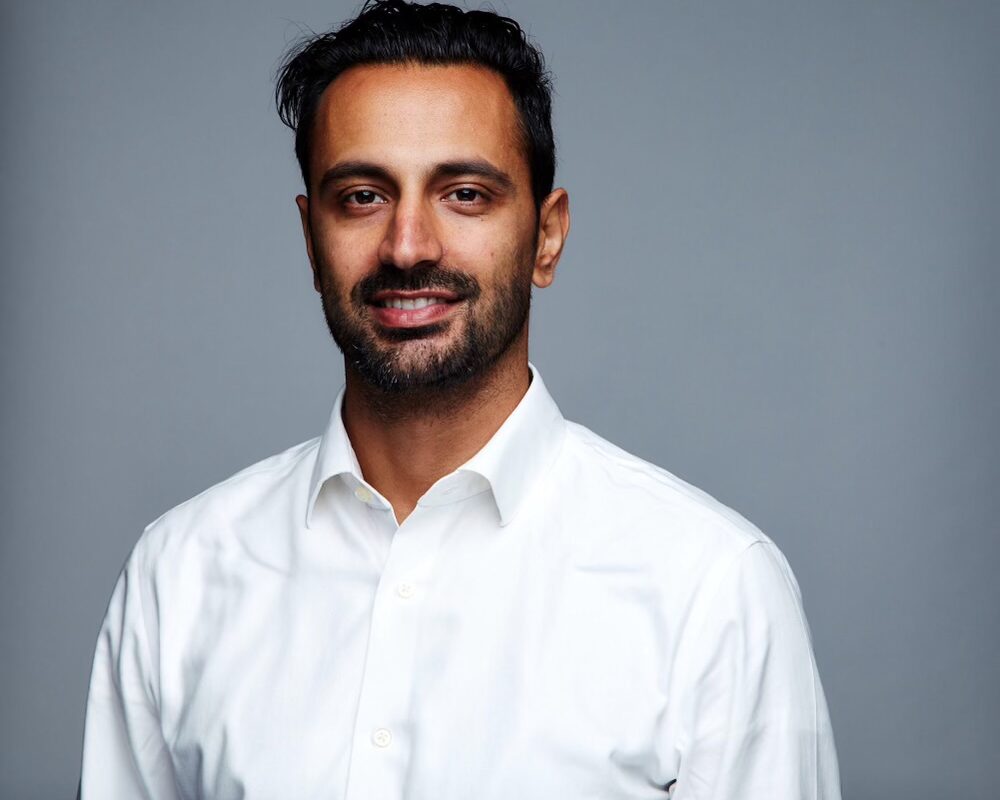 Smiling man in white shirt portrait